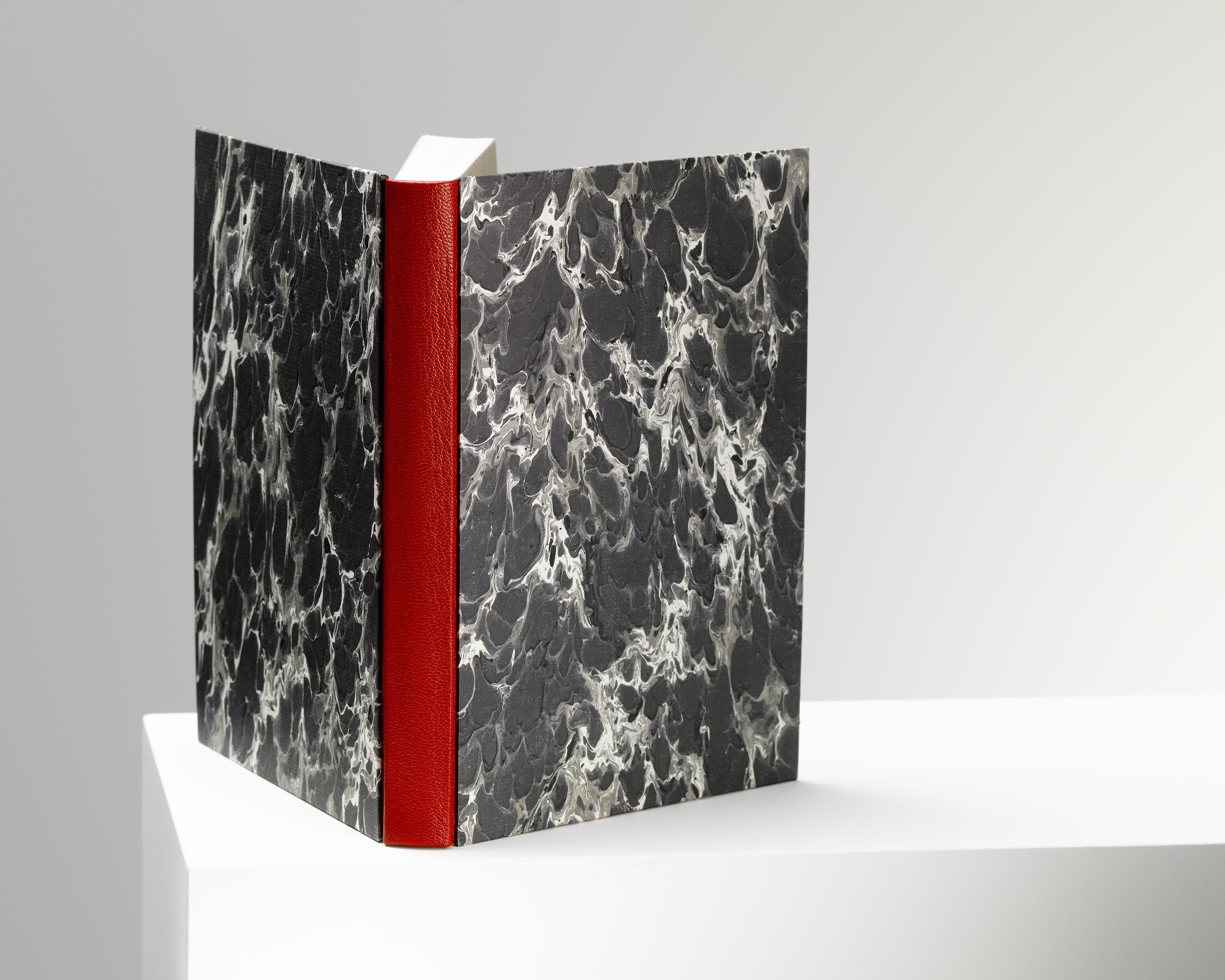 Bradel Bound Book, leather spine and head bands.